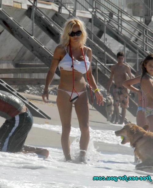 16P Pamela Anderson posing in topless and in thong and bikini pics