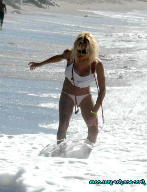 16P Pamela Anderson posing in topless and in thong and bikini pics