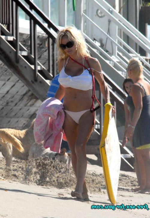 16P Pamela Anderson posing in topless and in thong and bikini pics