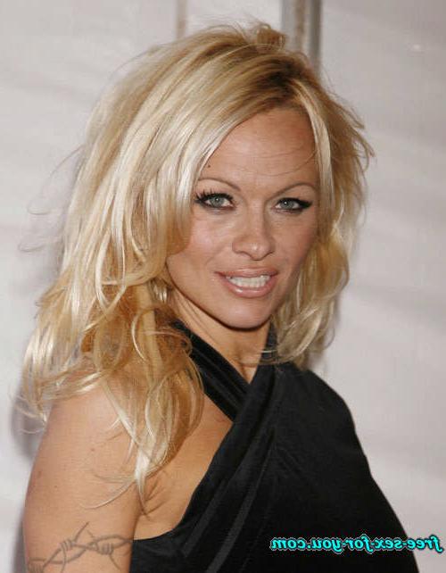 16P Pamela Anderson posing in topless and in thong and bikini pics
