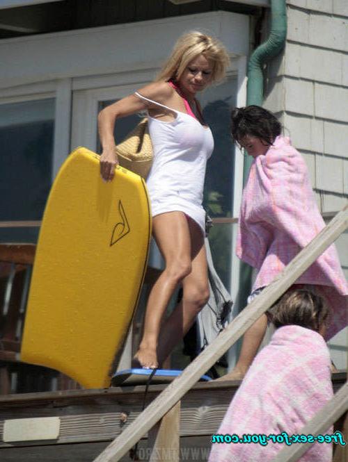 16P Pamela Anderson showing her big tits and walking in mini skirt