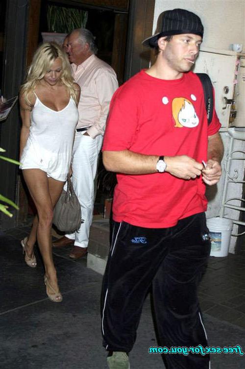 16P Pamela Anderson showing her big tits and walking in mini skirt