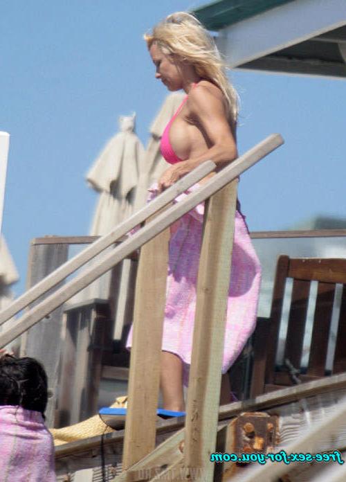 16P Pamela Anderson showing her big tits and walking in mini skirt