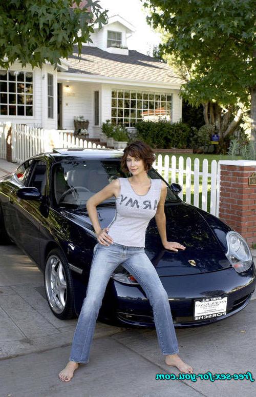 16P Catherine Bell posing in bikini and see thru dress