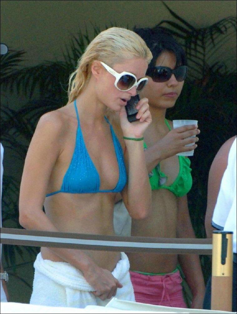 16P Paris Hilton nipple slip and bikini beach paparazzi pictures