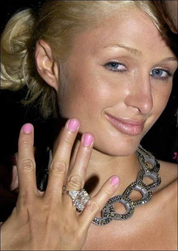 16P Paris Hilton nipple slip and bikini beach paparazzi pictures