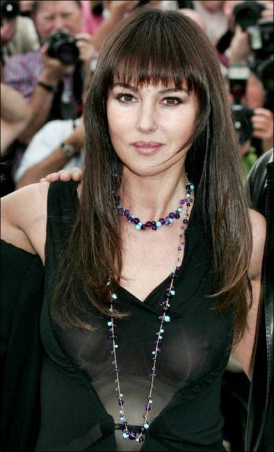 16P Cute italian actress Monica Bellucci showing perky tits