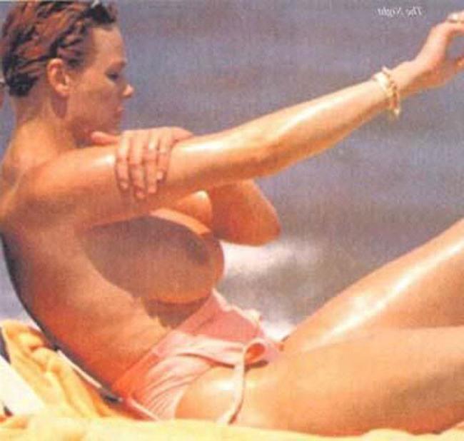 15P Brigitte Nielsen showing her huge boobs