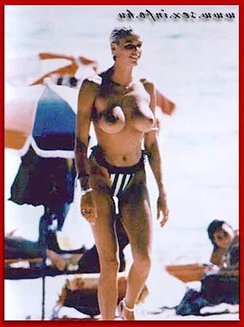 15P Brigitte Nielsen showing her huge boobs