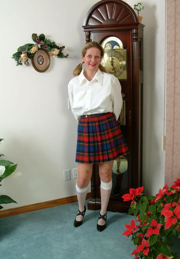15P Pigtailed mature in scotch skirt