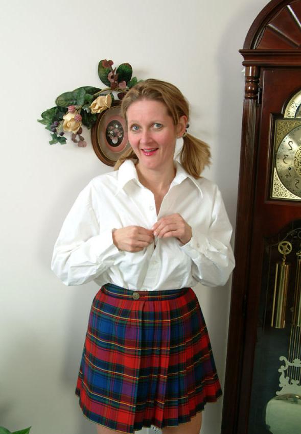 15P Pigtailed mature in scotch skirt