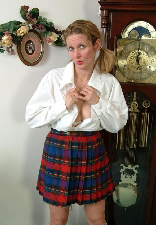 15P Pigtailed mature in scotch skirt