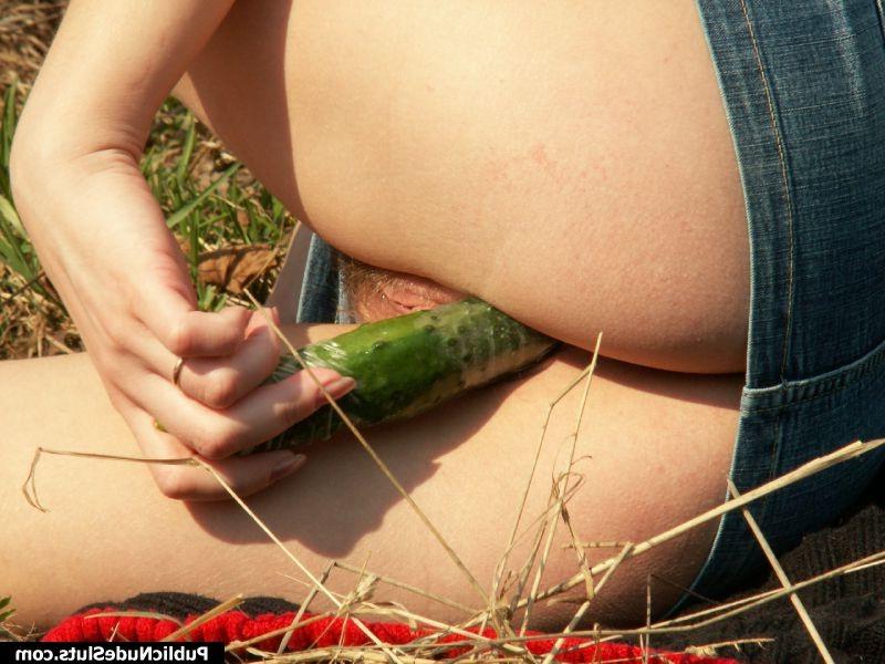 15P Naughty chick regales her tight pussy with a cucumber in public place