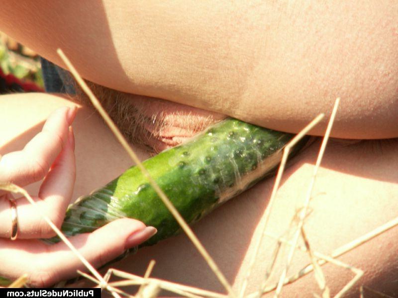 15P Naughty chick regales her tight pussy with a cucumber in public place