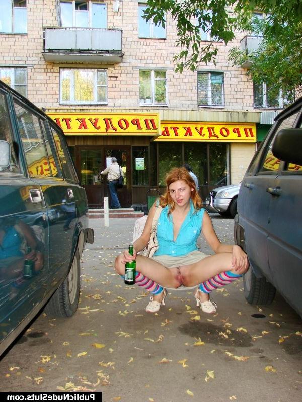 15P Adventurous hotsy has fun showing her titties and pussy in the street