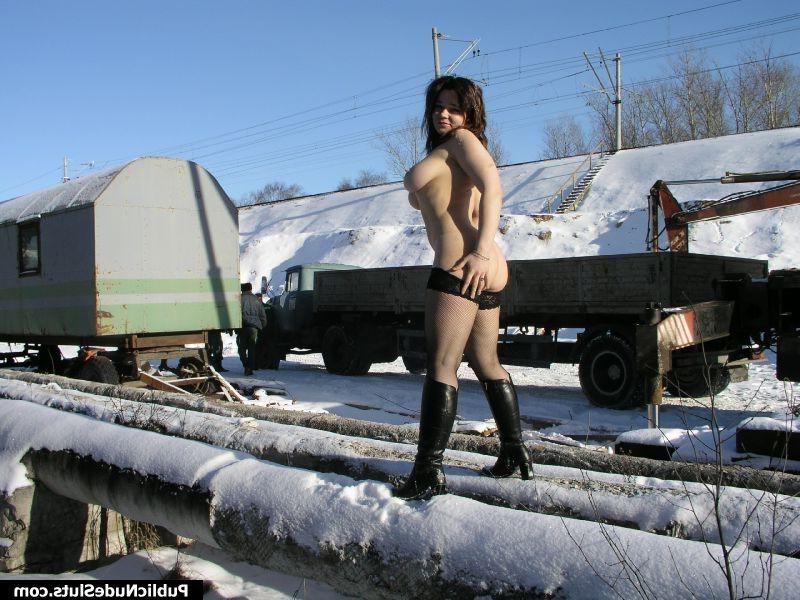 15P Busty sexpot flashes her knockers, pussy and ass in the snowy street