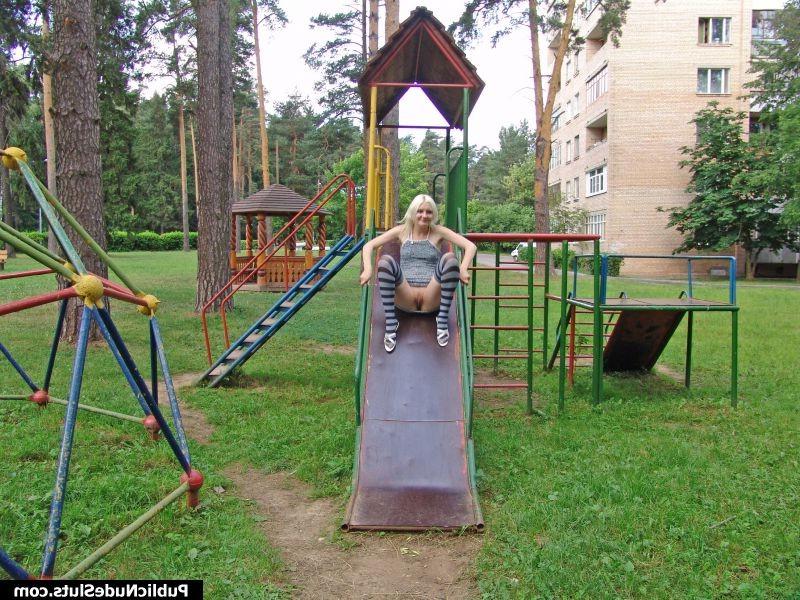 14P Impudent blondie displaying her nude titties and pinkie in the park