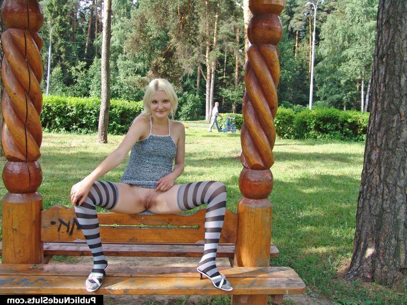 14P Impudent blondie displaying her nude titties and pinkie in the park