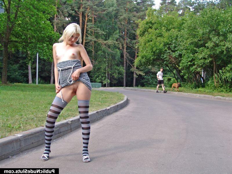 14P Impudent blondie displaying her nude titties and pinkie in the park