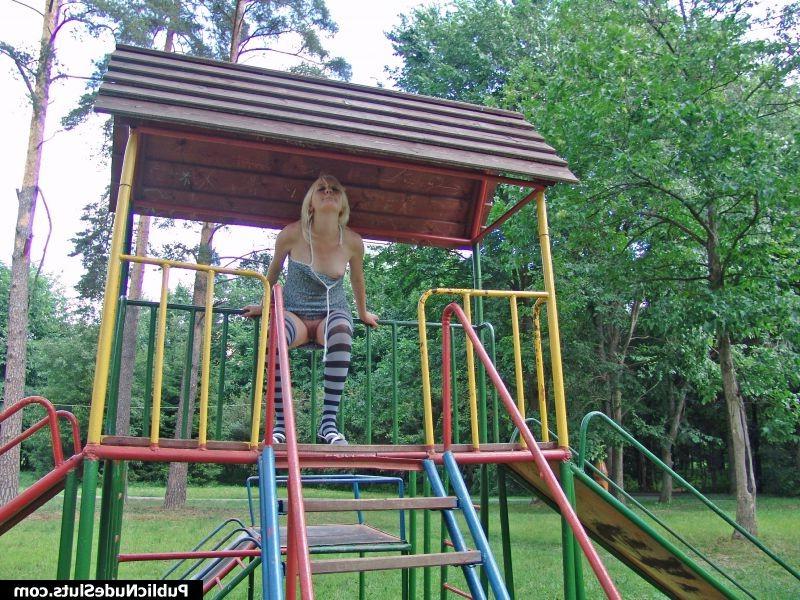 14P Impudent blondie displaying her nude titties and pinkie in the park