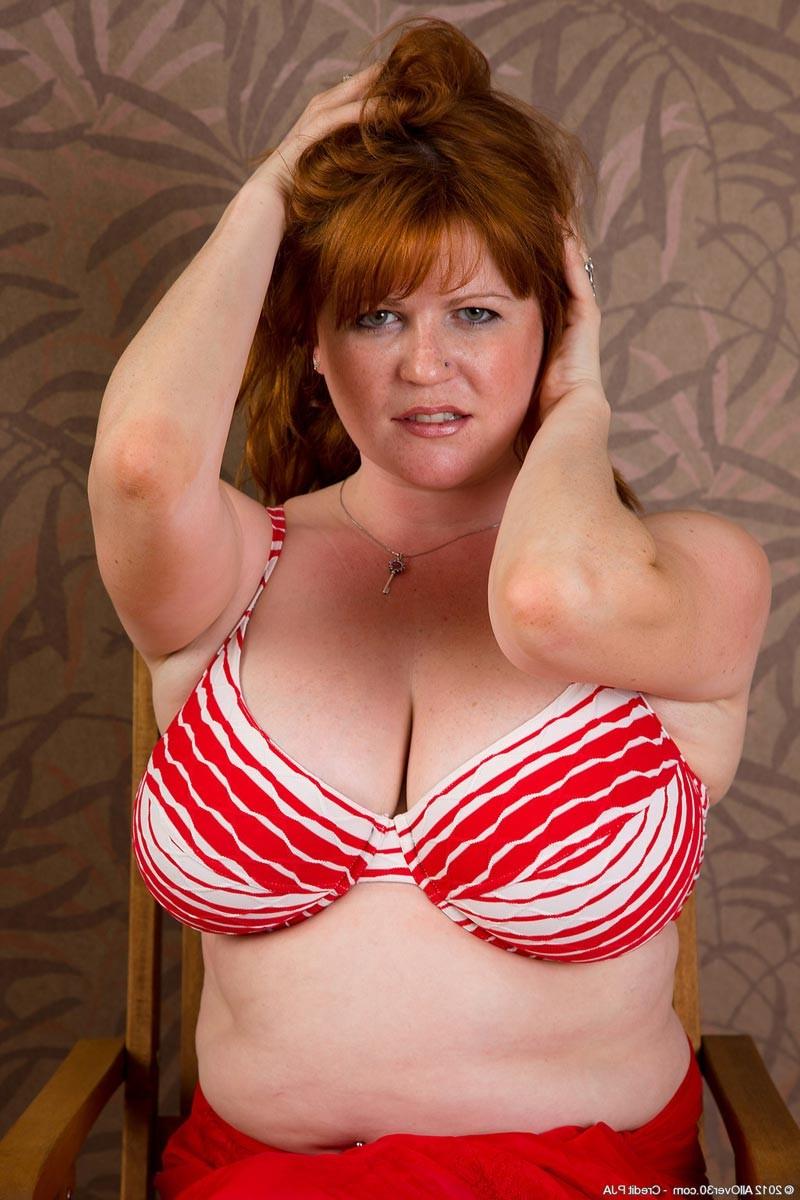 15P Horny big breasted mature gets naked