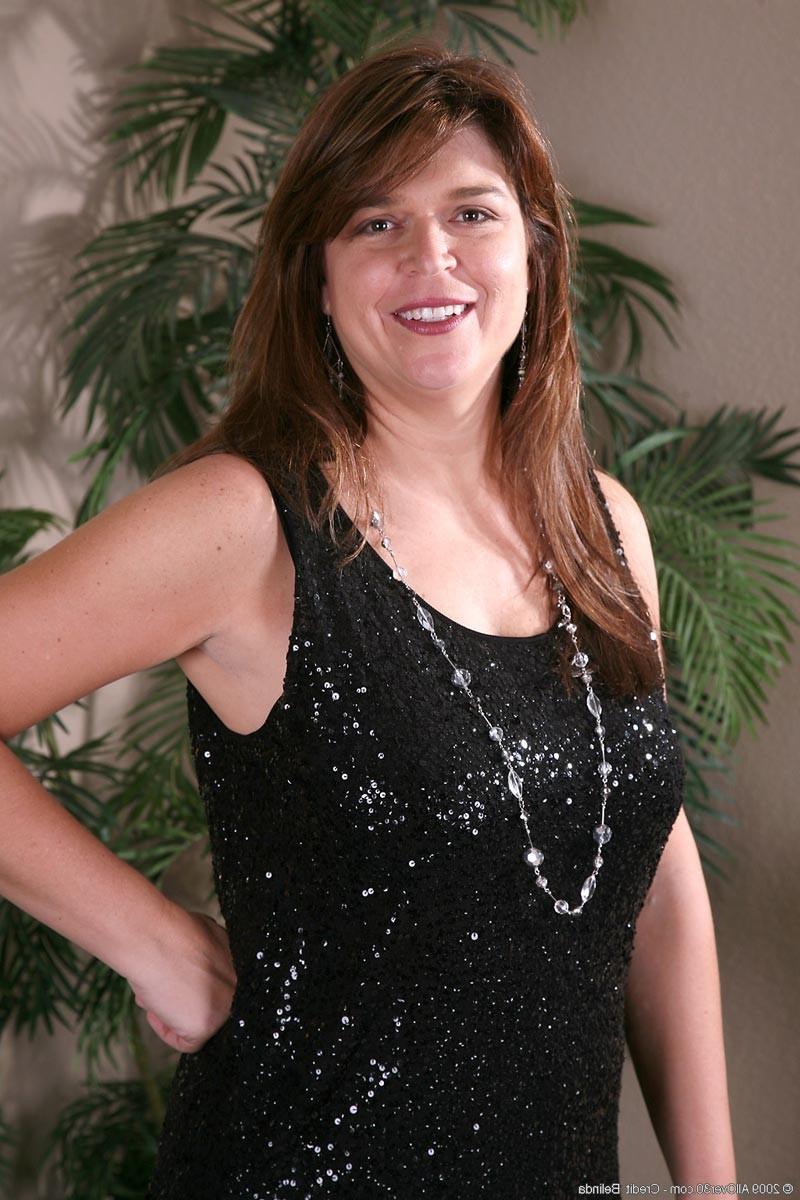 15P Horny mature with big natural juggs in black stockings