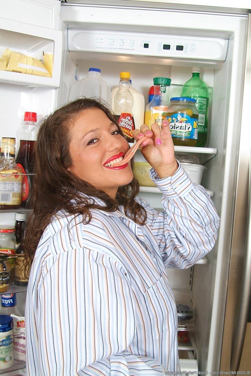 15P Big breasted wife playing with a cucumber in the kitchen