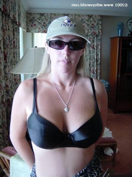 14P Wife in sunglasses blowing hubby