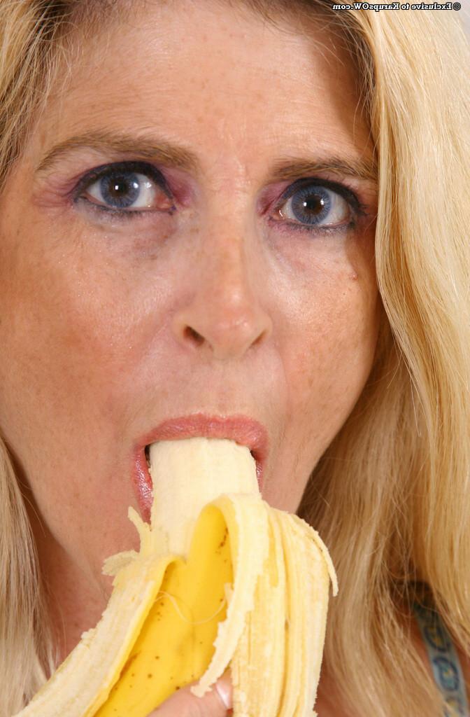 16P A sexy busty blonde mature lady eating a banana