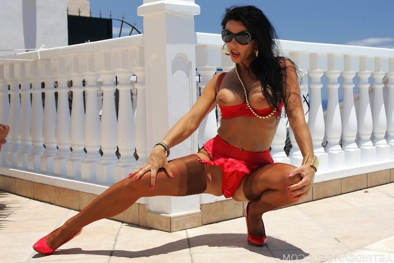 15P Latina girl in red lingerie and tan stockings getting hot
