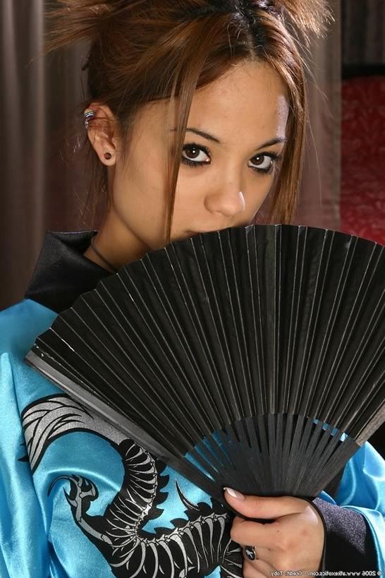 15P Exotic latina beauty shows off her pierced puffy nipples