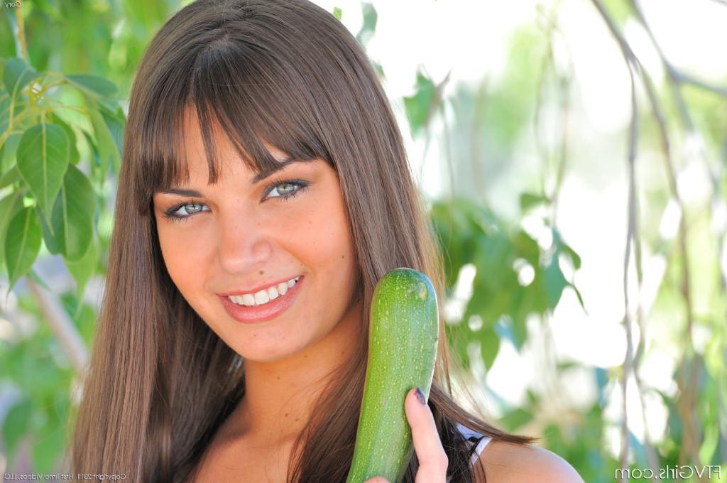 18P Beautiful brunette with sexy legs toying pussy with cucumber