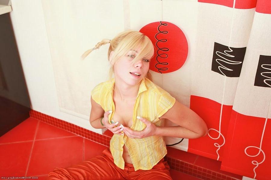 17P Small titted blonde teenie stuffing herself with banana