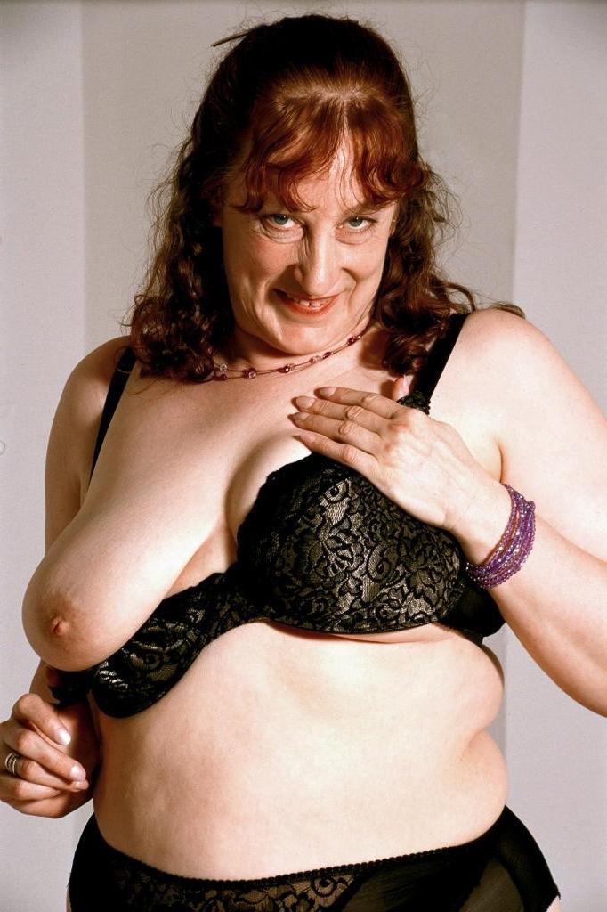 20P Mature in a dress strip teasing and spreading her pussy