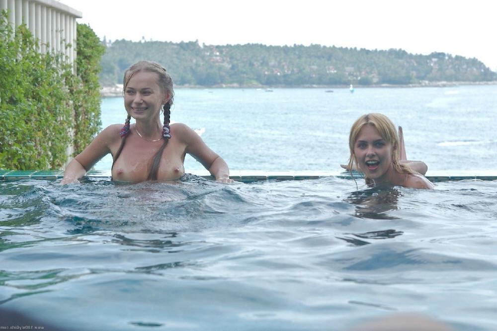 15P Three tiny girls swimming topless in a pool outside