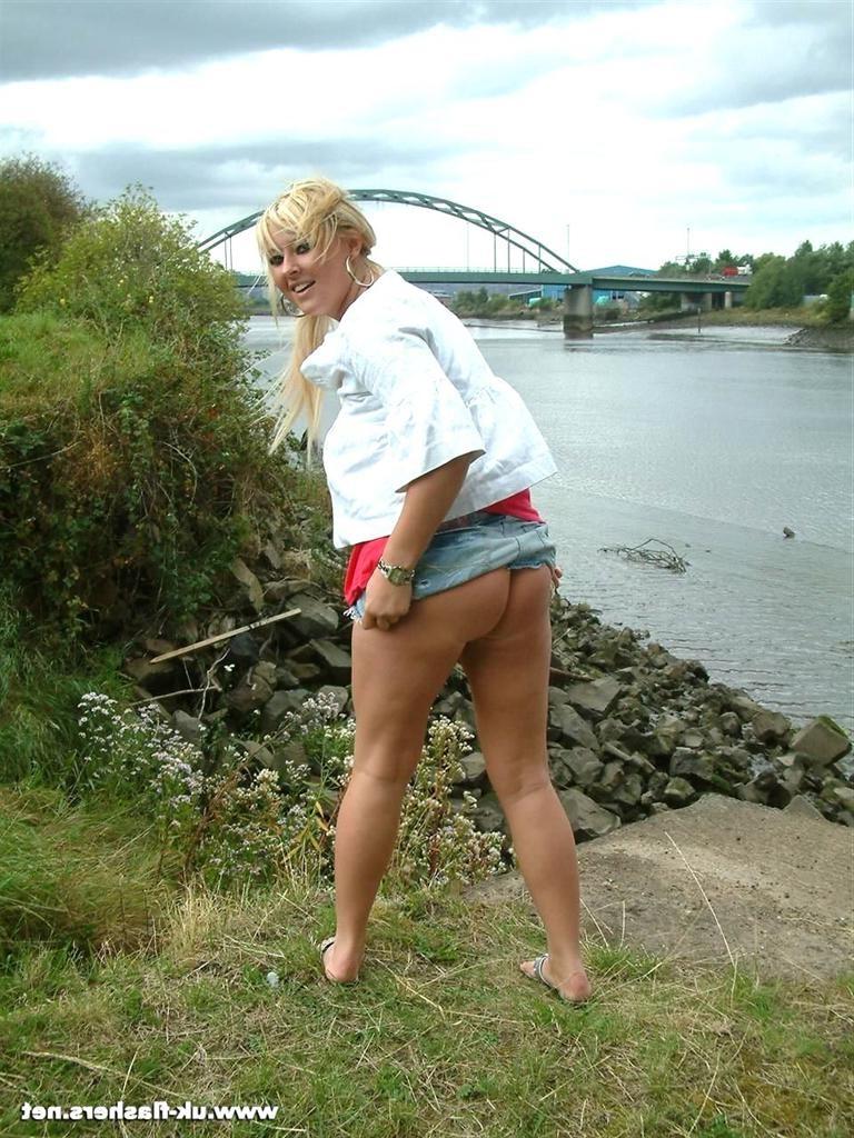 15P Cute amateur blonde exhibitionist flashing her tits by the river