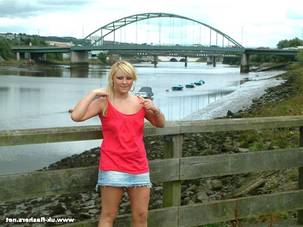 15P Cute amateur blonde exhibitionist flashing her tits by the river