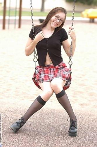 22P Brunette babe spreading on swing