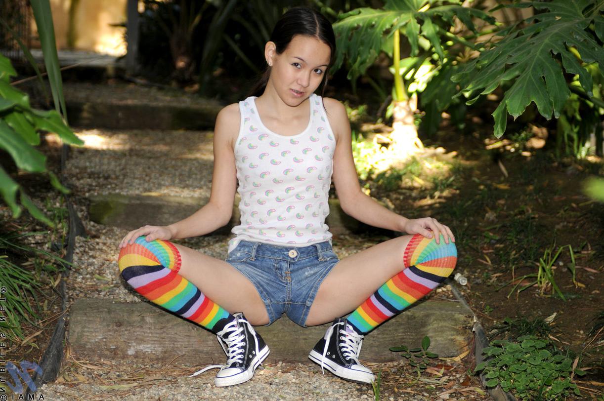 10P Exotic Asian Nubile pulls her panties to the side outdoors