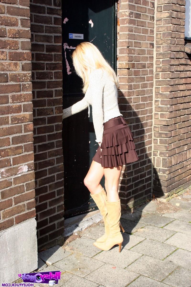 14P Blonde honey gets a big toilet surprise trough the wall