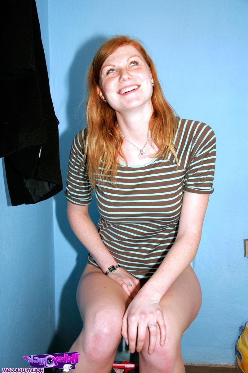 14P Redhead girl enjoys a big surprise erection trough the wall