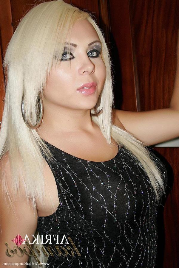 13P Elegant Transsexual Afrika Kampos comparing her big hard cock to a hefty banana