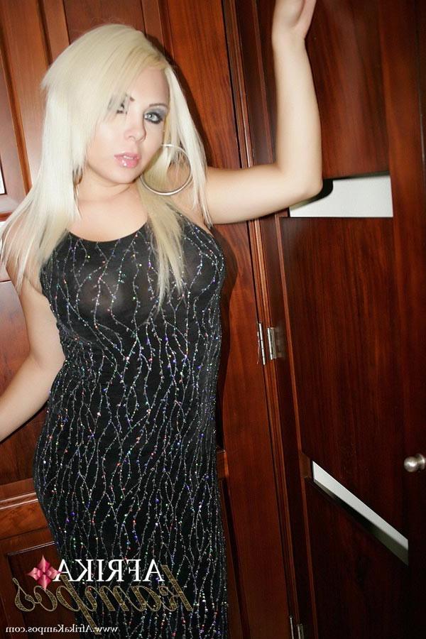 13P Elegant Transsexual Afrika Kampos comparing her big hard cock to a hefty banana