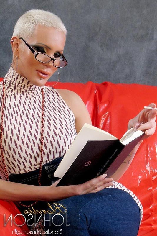 13P Smart and Sexy Tranny Blondie Johnson plays with her cock while reading an eroti