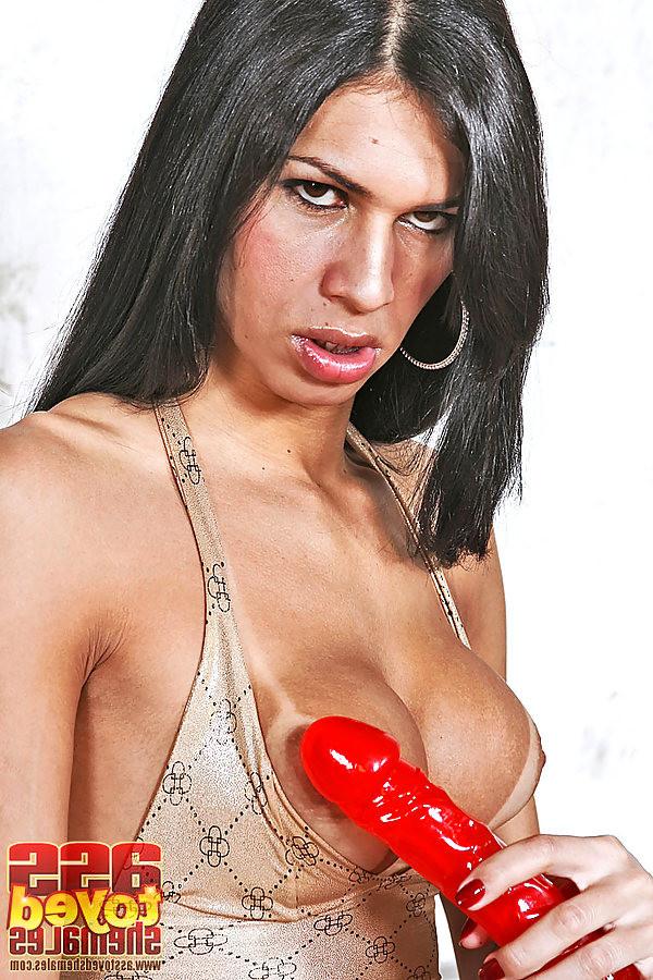 17P tranny stripping and creaming and using a huge red anal dildo