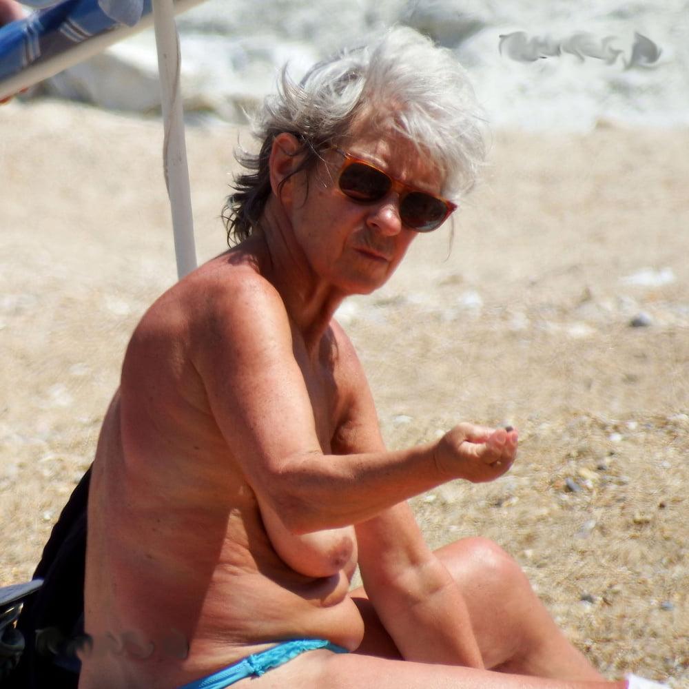 20P grandmother sunbathing on the beach