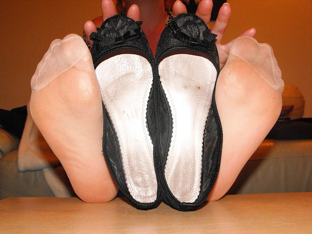 7P Em showing nylon soles and inside her flats for your cum
