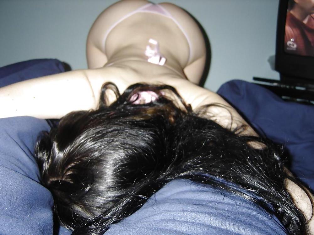 25P TEEN POSING ON A BED