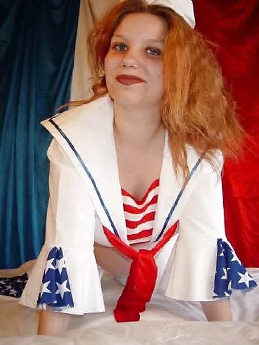 14P Pregnant redhead taking off her sailors uniform