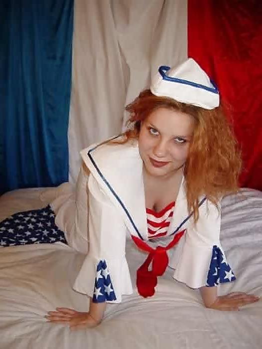 14P Pregnant redhead taking off her sailors uniform